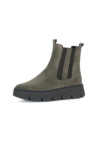Gray suede ankle boot with elastic side panels, rounded toe, and a thick black platform sole featuring a jagged design.