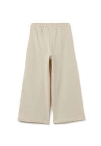 Beige weit geschnittene Hosen aus weichem Stoff, mit elastischem Bund und zwei Seitentaschen. Glatte Textur ohne sichtbare Muster.