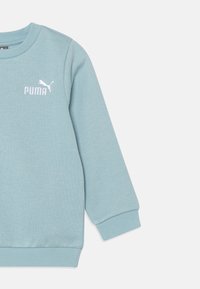 Puma UNISEX SET turkusowy