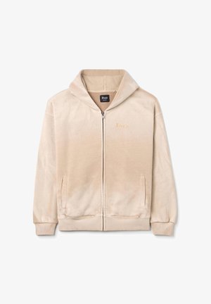 Beige Zip-Up Hoodie aus weichem Stoff, mit lockerer Passform, Kapuze, Fronttaschen und dezent gesticktem Branding auf der Brust.