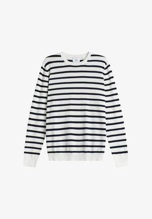 Valkoinen pitkähihaisen neulepaita, jossa tasaisesti sijoitetut mustat vaakaraitaruudut ja pyöreä pääntie, aseteltu tasaisesti valkoiselle taustalle.