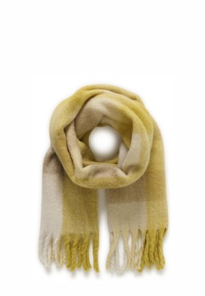 Geltonos ir kremų spalvų dryžuotas šalikas, pagamintas iš minkštos medžiagos, puoštas kutų kraštais ir turintis šiltą tekstūrą. Apvalios formos, sluoksniuotos spalvos.