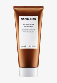 Tube de traitement capillaire SACHAJUAN, 100 ml, avec une finition métallique bronze, une étiquette blanche avec du texte noir et un bouchon à vis blanc.