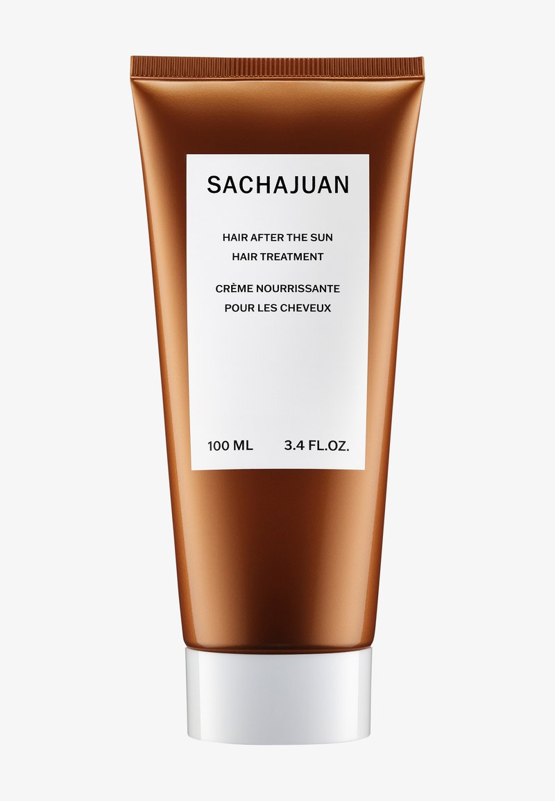 SACHAJUAN hårbehandling tub, 100 ml, har en bronse metallisk finish, en hvit etikett med svart tekst og et hvitt skrulokk.