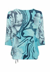 Lange mouw top in lichtblauw met abstracte bloemmotieven in donkerblauw en teal, voorzien van een trekkoord onderaan en een loose fit.