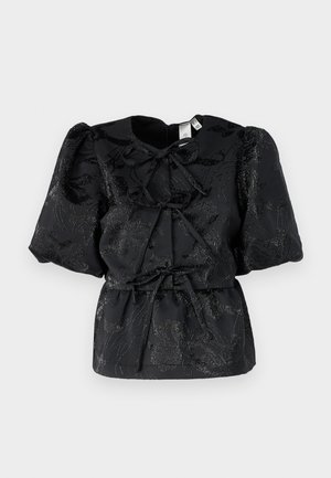 Black top with short puff sleeves, featuring a textured floral pattern and a drawstring waist. Made from a shiny fabric with subtle shimmer.