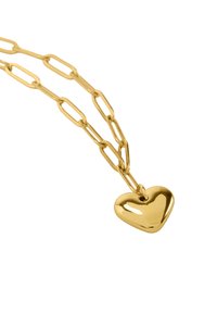 Złoty naszyjnik z podwójnym łańcuszkiem o wydłużonych ogniwach i gładką, błyszczącą zawieszką w kształcie serca.