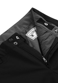 Zwarte broek met een interieurzicht van een grijze voering, rits en drukknoopsluitingen. Beschikt over een label met een spinlogo aan de binnenkant.