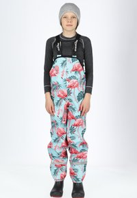 Children's waterproof overalls featuring a light blue base with a pink flamingo and green foliage pattern. Includes adjustable black straps.