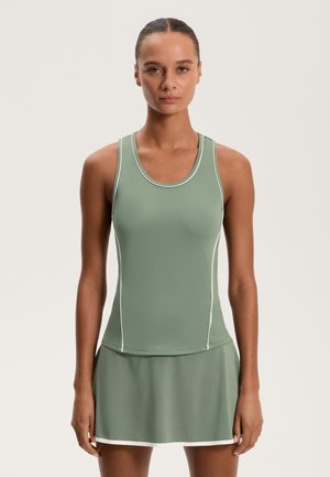 Tricou sport verde cu accente albe, design ajustat și fustă evazată. Textură netedă, decolteu rotund și stil fără mâneci.