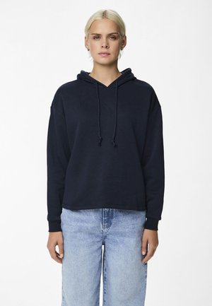 Navy blue hooded sweatshirt with a loose fit, drawstring, and ribbed cuffs. Paired with light blue wide-leg jeans. Smooth texture.
