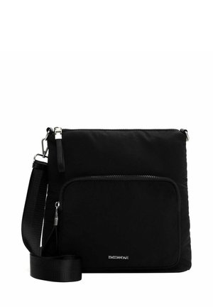 Black nylon crossbody bag with a large front zip pocket, adjustable strap, and silver hardware accents. Smooth texture and rectangular shape.