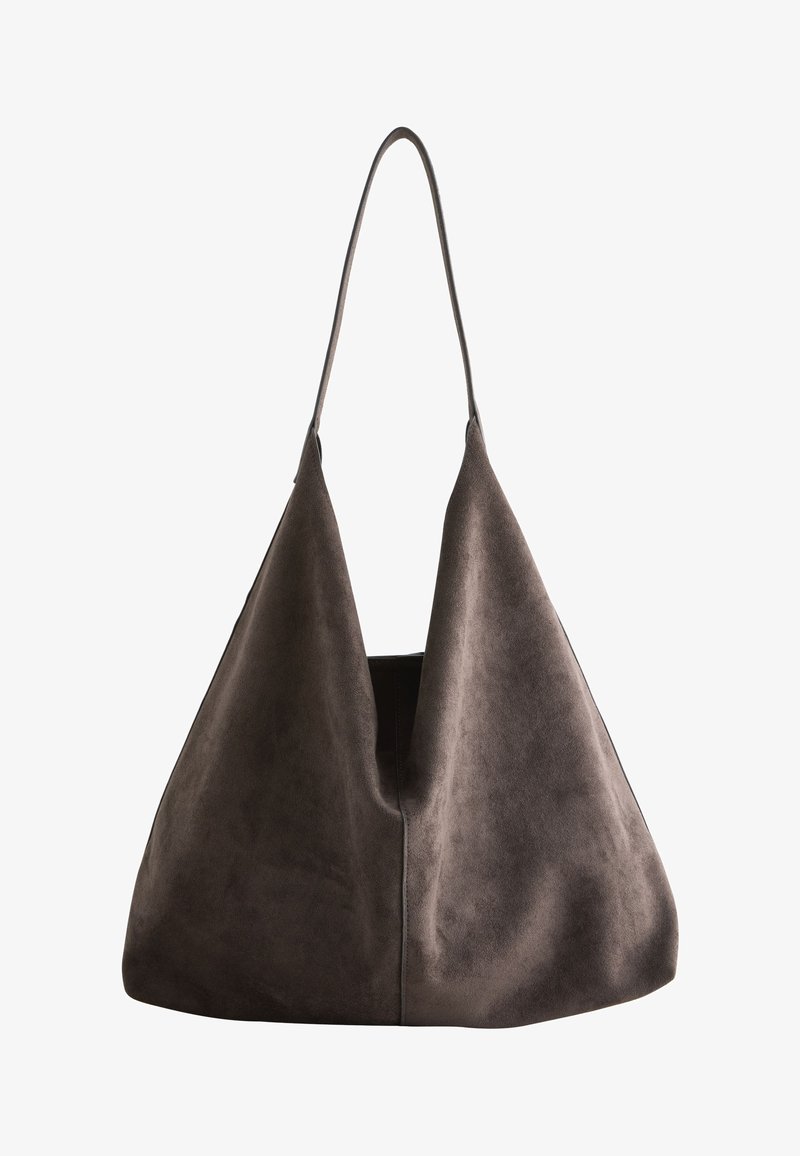 Large brown suede shoulder bag with a single long strap and a soft, slouchy triangular shape.