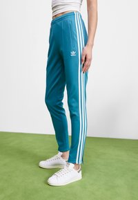 adidas Originals ADICOLOR SUPERSTAR TRACK - Spodnji deli trenirk - arctic fusion