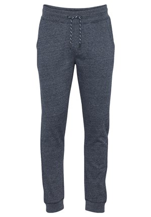 Navy blue sweatpants made of soft, textured fabric. Features an elastic waistband with a drawstring and cuffed ankles for adjustable fit.