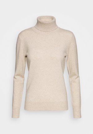 Beige pitkähihoinen pooloneule, jossa on ribbattu kaulus, hihansuut ja helma, esitetty yksinkertaisella valkoisella taustalla.