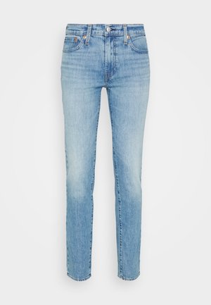 Light blue denim jeans with a straight fit, featuring a faded wash, classic five-pocket design, and metal button closure at the waist.