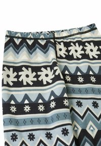 Leggings aus einem strukturierten, dehnbaren Stoff mit einem geometrischen Muster in Blau, Schwarz und Weiß, einschließlich Schneeflocken- und Zickzackdesigns.