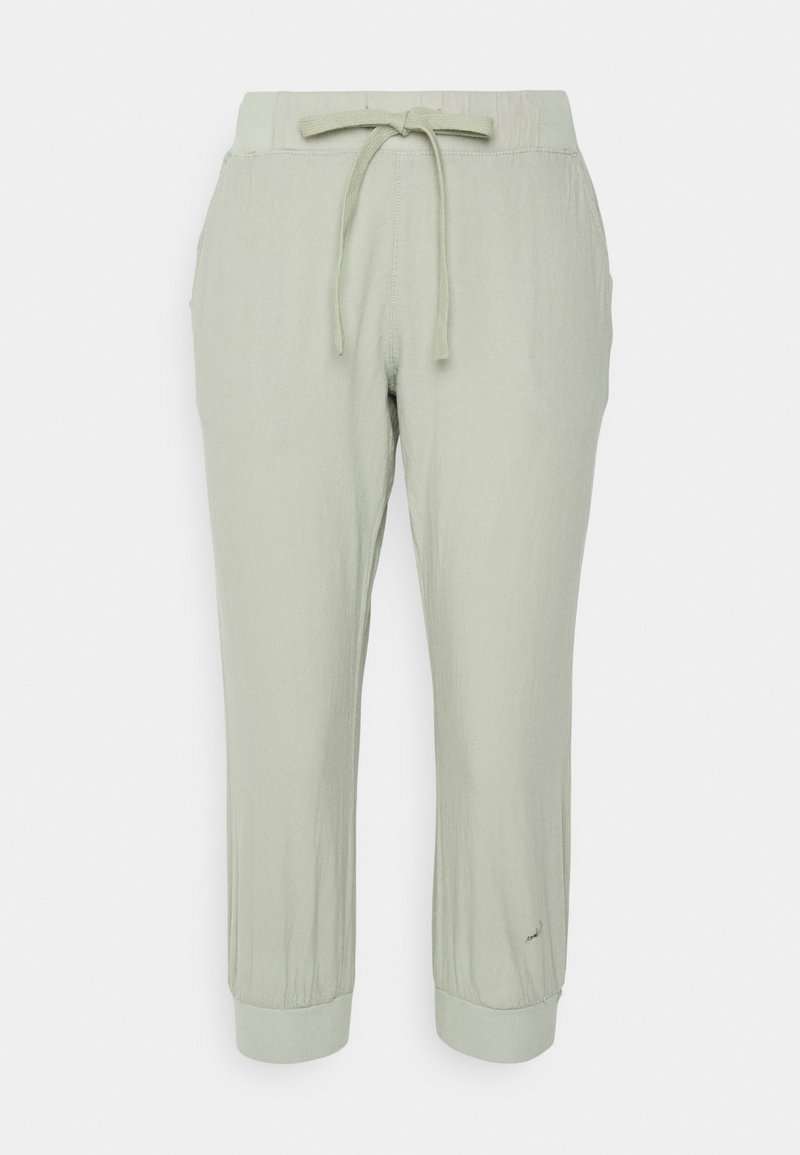 Pantalon de jogging léger vert clair avec taille à cordon, poignets élastiques et poches latérales. Tissu doux et texturé.