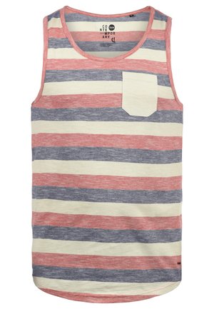 Débardeur rayé en rouge, marine et crème. Présente un col rond, une poche sur la poitrine gauche et une coupe ample. Tissu doux et texturé.