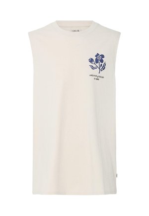 Ermeløs offwhite skjorte med marineblått blomsterdesign og teksten «ARCHIVE of SOLID © 1999» på øvre venstre bryst.