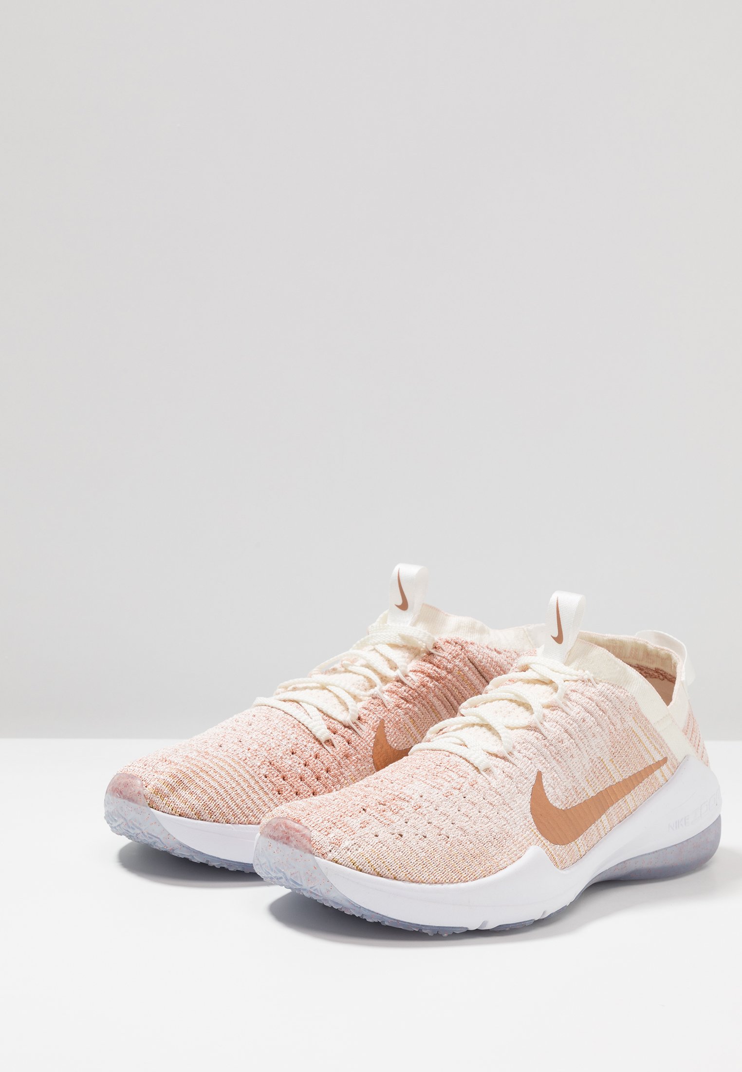 nike training air zoom fearless trainers in rose gold