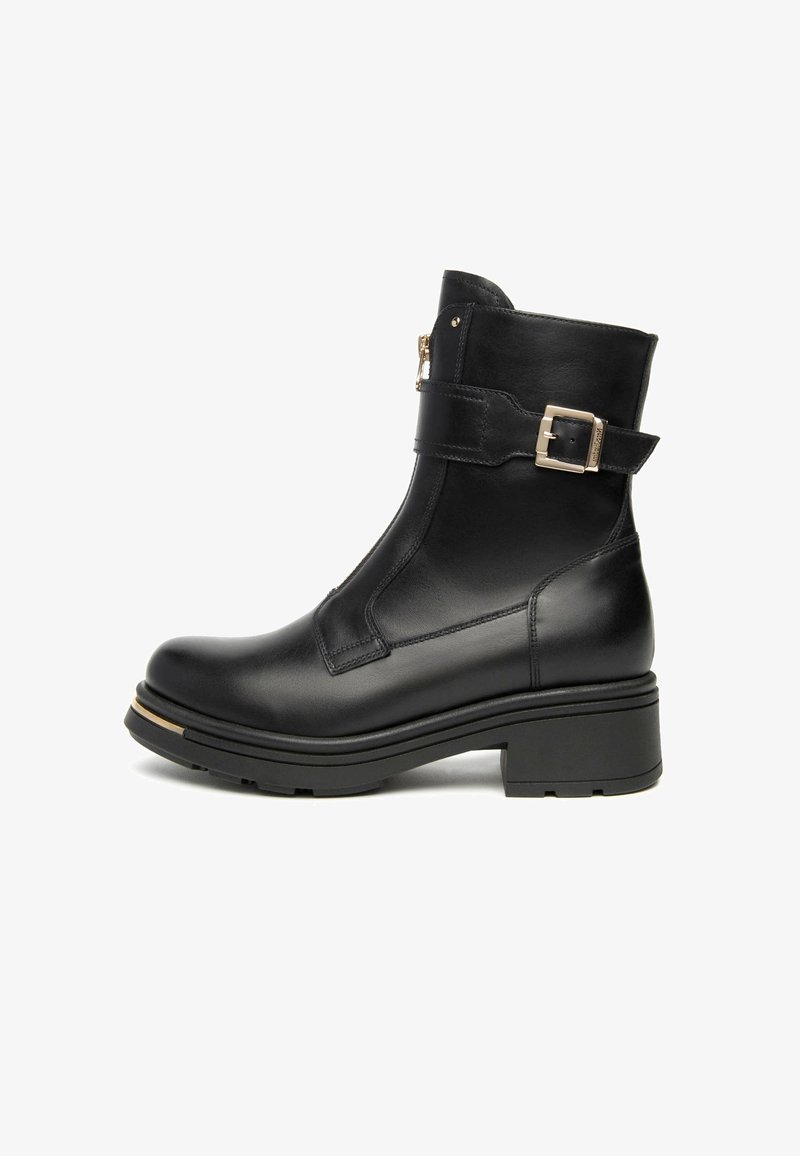 Black leather ankle boot with a smooth finish, round toe, side zipper, adjustable buckle strap, and a chunky heel with gold accent.