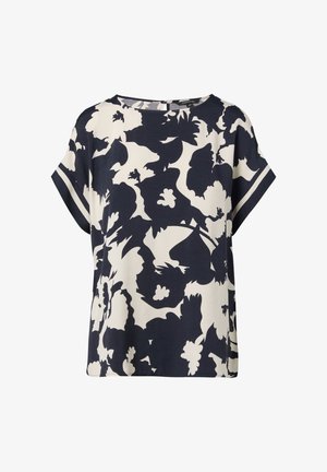 Niebiesko-kremowa bluzka z krótkim rękawem w kwiatowy wzór, z okrągłym dekoltem i luźnym krojem, wykonana z lekkiego materiału.