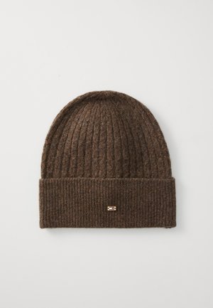 Brown knitted beanie with a ribbed texture, featuring a folded cuff and a small metal accent on the front.
