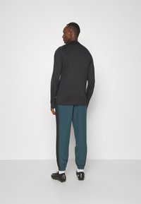Nike Performance NIKE ACADEMY23 TRACK PANTS - Træningsbukser - deep jungle/black