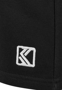 Black fabric with a textured finish features a white embroidered logo in a square shape, positioned near the bottom edge.