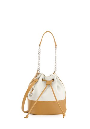 Bucket bag with a white faux leather top and a tan faux leather bottom. Features a drawstring closure, silver chain, and tan shoulder strap.