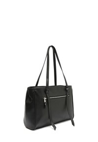 Sort læder tote taske med to lange håndtag, en lynlåslomme foran og en glat tekstur. Runde hjørner og struktureret design.