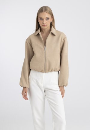 Felix Hardy, Veste en similicuir - beige