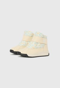 Beige wasserdichte Stiefel mit einem gemusterten Obermaterial in Pastellfarben, Klettverschluss und schwarzer Gummisohle mit strukturiertem Profil.