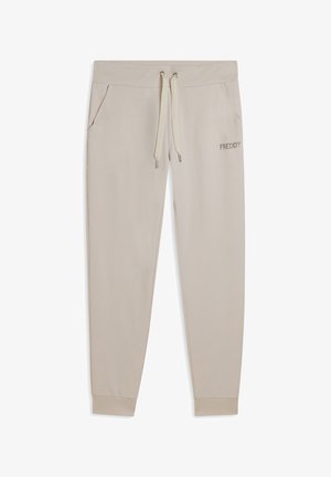 Pantaloni jogger beige a taglio slim con elastico in vita e coulisse, tasche laterali, polsini alle caviglie e logo "FRENDY" sulla coscia destra.