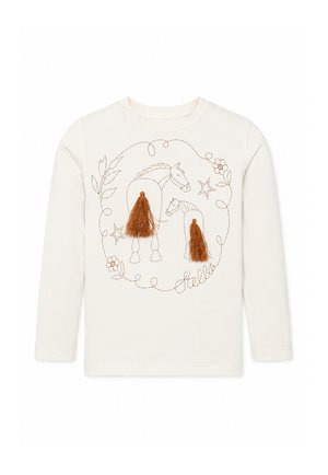 Crèmekleurig shirt met lange mouwen met gestikte omtrek van twee paarden, kwaststaarten, sterren, bloemen, bladeren en het woord 'hello' in cursief.