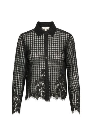 Svart spetsblus med rutigt mönster, knäppning fram och krage. Genomskinliga ärmar med blommönster och fransar i nederkant.
