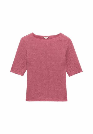 Vaaleanpunainen teksturoitu lyhythihainen paita, jossa on neliönmuotoinen pääntie ja loiva istuvuus. Paidassa on kuvioitu kangas, joka lisää visuaalista mielenkiintoa.