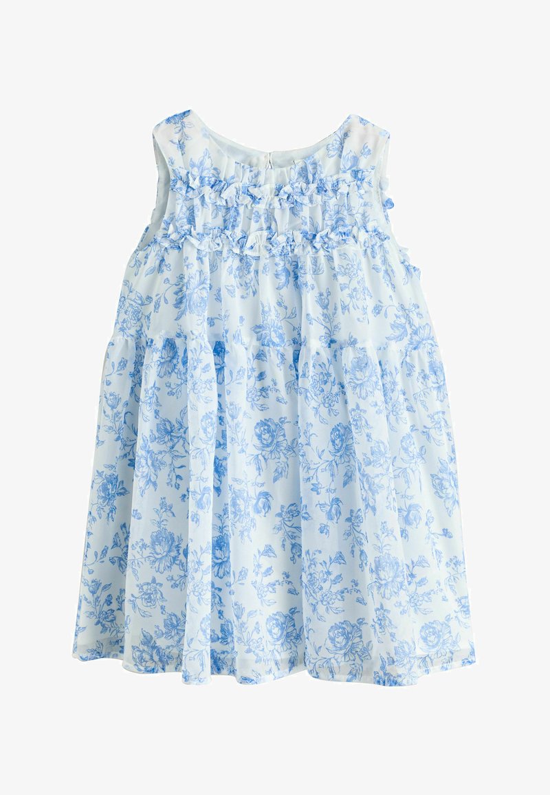 Robe blanche sans manches avec imprimé floral bleu et détails à volants sur le corsage, taille froncée et jupe fluide.