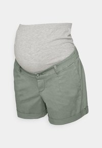 Graviditysshorts i ljusgrön bomullsblandning. Designade med ett grått stretchigt magband och uppvikta fållar för komfort och justering.