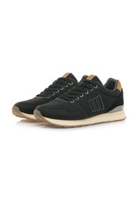 Schwarze Sportschuhe mit einer strukturierten Oberseite, cremefarbenem Zwischensohle, hellbraunen Akzenten und einem Logo an der Seite. Mit Schnürsenkeln und gepolstertem Kragen.