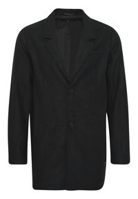 Blazer negro hecho de tejido texturizado, con un diseño de un solo botón, dos bolsillos frontales, dos botones y un cuello con muesca.
