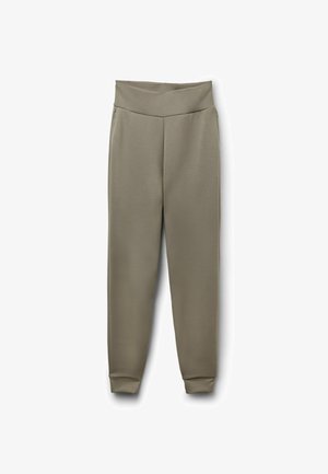 Pantalon fuselé vert olive clair avec une large bande élastique à la taille et aux poignets, fabriqué en tissu lisse, posé à plat sur un fond blanc.