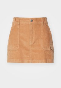 Lichtbruine corduroy minirok met een hoge tailleband, voorzakken en een gladde textuur met verticale ribbels.