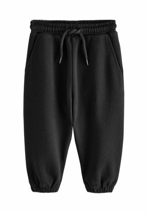 Zwarte trainingsbroek met een elastische tailleband met trekkoord, zijzakken en elastische boorden bij de enkels, gemaakt van zachte stof.