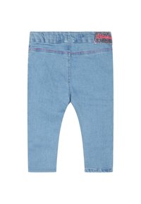 Ljusblå denimleggings med en texturerad tyg, med en rosa glittrig logotyp på midjebandet och kontrasterande sömdetaljer.