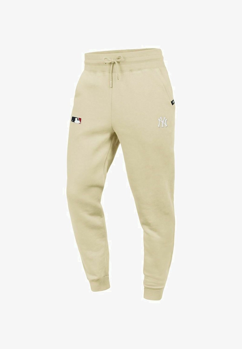 Helle beige Sweatpants aus weichem Baumwollgemisch, mit elastischem Bund, Kordelzug und gesticktem New York Yankees-Logo.