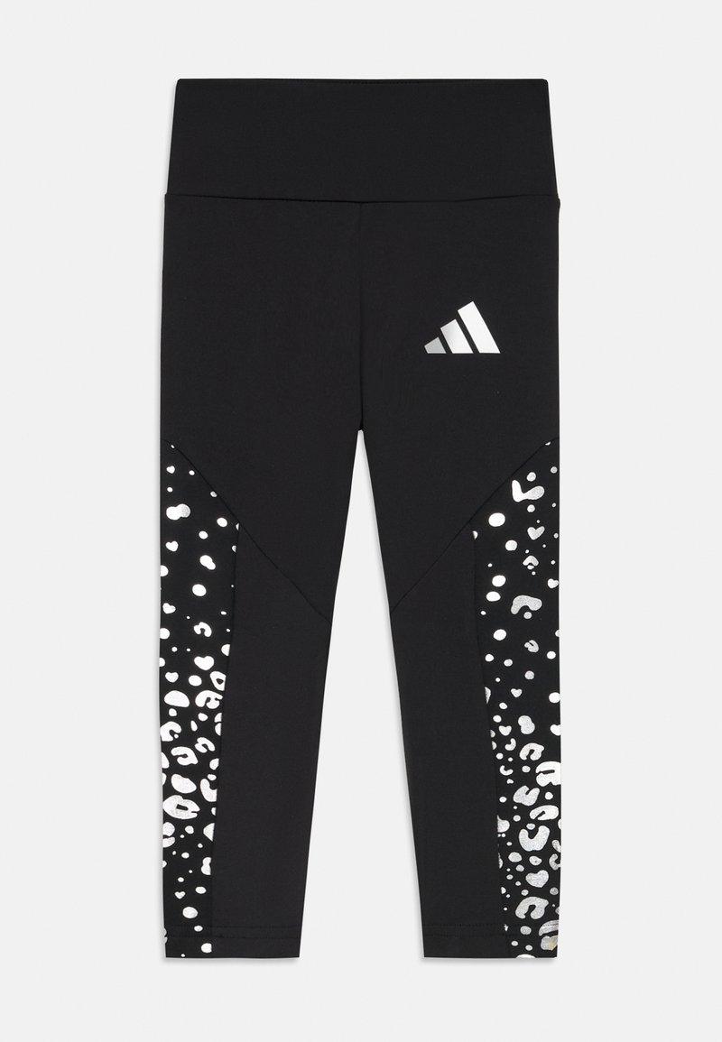 Svarta leggings med en bred midjeresår, en sidopattern i metallisk silver leopardtryck och mjukt, stretchigt material.