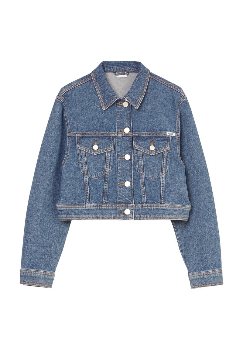 Cropped denim jacket in medium blue, featuring a button-front closure, two chest pockets, and subtle stitching details. Classic collar and long sleeves.